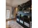 Stylish entryway with a dark accent wall, beverage center, and decorative shelving at 16825 N 14Th St # 125, Phoenix, AZ 85022