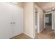 Hallway with carpet flooring, closet, and access to bathroom at 16825 N 14Th St # 125, Phoenix, AZ 85022