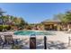 Community pool with chairs, tables, and cabana; lush landscaping at 16825 N 14Th St # 125, Phoenix, AZ 85022