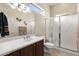 The bathroom has a shower-tub combo with a privacy curtain and a vanity sink with good lighting at 16927 W Desert Blossom Way, Surprise, AZ 85387