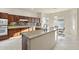 Modern kitchen boasting granite countertops, stainless steel appliances, and a bright breakfast nook with picturesque window views at 16927 W Desert Blossom Way, Surprise, AZ 85387