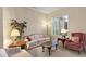 Cozy living room with natural light, comfortable seating, and a tranquil atmosphere, perfect for relaxation and conversation at 16927 W Desert Blossom Way, Surprise, AZ 85387