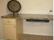 Built in desk space with drawers, cabinets, and marble counter at 18416 N Cave Creek Rd # 1053, Phoenix, AZ 85032