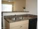 Kitchen featuring stainless sink, faucet, countertops, and dishwasher at 18416 N Cave Creek Rd # 1053, Phoenix, AZ 85032
