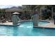 A community pool with water features and nearby seating area at 18416 N Cave Creek Rd # 1053, Phoenix, AZ 85032