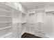 A spacious walk-in closet offering ample shelving and storage options at 18552 N 94Th St, Scottsdale, AZ 85255