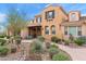 Beautiful home exterior with desert landscaping, a covered front porch and inviting curb appeal at 18552 N 94Th St, Scottsdale, AZ 85255