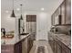 Stylish kitchen featuring granite counters, dark wood cabinets, and stainless steel appliances at 18552 N 94Th St, Scottsdale, AZ 85255