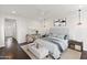 This main bedroom has a ceiling fan, multiple windows, and neutral colors at 18552 N 94Th St, Scottsdale, AZ 85255
