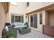 Charming patio with stone pavers, comfortable seating, and gas grill for outdoor entertaining and relaxation at 18552 N 94Th St, Scottsdale, AZ 85255