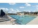 Community lap pool with chaise lounges and lush landscape surrounded by clear blue skies at 18552 N 94Th St, Scottsdale, AZ 85255
