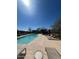 Resort-style pool with lounge chairs and a covered area, perfect for relaxation and enjoying the sunny weather at 18552 N 94Th St, Scottsdale, AZ 85255