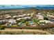 Aerial view showcasing a beautiful desert home with an inground pool and mountain views at 1922 E Saltsage Dr, Phoenix, AZ 85048