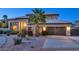 Beautiful desert home featuring an attached garage, mature landscaping, and a tile roof at 1922 E Saltsage Dr, Phoenix, AZ 85048