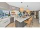 Bright kitchen with a large island, stainless steel appliances, and decorative pendant lighting at 1922 E Saltsage Dr, Phoenix, AZ 85048