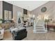 Open-concept living area with dining space, grand staircase, and elegant decor at 1922 E Saltsage Dr, Phoenix, AZ 85048