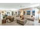 Bright and airy living room with plush sofas, stylish decor, and large windows at 1922 E Saltsage Dr, Phoenix, AZ 85048