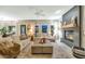 Relaxing living room with fireplace, comfortable sofas, and cozy ambiance at 1922 E Saltsage Dr, Phoenix, AZ 85048