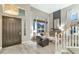 Bright living room with tall windows, neutral decor, and stylish furnishings at 1922 E Saltsage Dr, Phoenix, AZ 85048