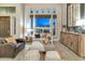 Cozy living room with large window, comfortable seating, and stylish decor at 1922 E Saltsage Dr, Phoenix, AZ 85048