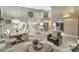 Inviting living area with dining space, staircase, and stylish furnishings at 1922 E Saltsage Dr, Phoenix, AZ 85048