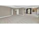 Spacious main bedroom boasts neutral walls and carpet, adjacent bathrooms, and ample natural light at 1922 E Saltsage Dr, Phoenix, AZ 85048