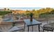 Outdoor patio offers a scenic view, comfortable seating, and overlooks a pool and desert landscape at 1922 E Saltsage Dr, Phoenix, AZ 85048