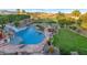 Stunning pool with waterslide, lounge area, and lush landscaping overlooking mountain views at 1922 E Saltsage Dr, Phoenix, AZ 85048