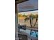 Relaxing backyard view, featuring a water feature, palm trees, and neighborhood scenery at 2535 N Pinnule Cir, Mesa, AZ 85215