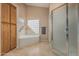 Bright bathroom featuring bathtub, walk-in shower and linen storage at 2535 N Pinnule Cir, Mesa, AZ 85215