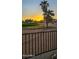 Scenic view of a golf course and palm trees at sunset, perfect for enjoying outdoor activities and the beautiful landscape at 2535 N Pinnule Cir, Mesa, AZ 85215
