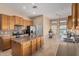 Bright kitchen with center island, stainless steel appliances, and view of the breakfast area at 2535 N Pinnule Cir, Mesa, AZ 85215