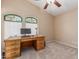 Well-lit office featuring a large desk, carpeted floor and stained glass windows at 2535 N Pinnule Cir, Mesa, AZ 85215