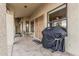 Covered patio featuring outdoor seating and a barbecue grill at 2535 N Pinnule Cir, Mesa, AZ 85215