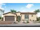 Charming single-story home featuring a tile roof, arched entry, and a two-car garage at 2536 E Tepenade Dr, San Tan Valley, AZ 85140