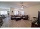 Spacious living room with a ceiling fan, and a comfortable leather sofa set at 2583 N Kenna Pl, Casa Grande, AZ 85122