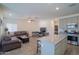 Open living space featuring modern kitchen with an island open to living room at 2583 N Kenna Pl, Casa Grande, AZ 85122