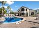 Backyard view showcasing a private pool, landscaping, and a two-story home at 2702 S Beverly Pl, Chandler, AZ 85286