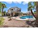 Charming backyard featuring a pool, spa, and balcony overlooking a desert landscape at 2702 S Beverly Pl, Chandler, AZ 85286
