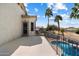 This home has a balcony with a view overlooking the pool and palm trees at 2702 S Beverly Pl, Chandler, AZ 85286