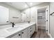 Bright bathroom featuring a double vanity with marble countertop and walk-in shower at 2702 S Beverly Pl, Chandler, AZ 85286