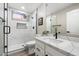 Modern bathroom featuring a walk-in shower, single vanity, and black hardware at 2702 S Beverly Pl, Chandler, AZ 85286