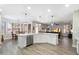 Bright, open kitchen featuring an island with stone countertops and stainless steel appliances at 2702 S Beverly Pl, Chandler, AZ 85286
