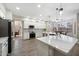 Bright kitchen featuring white cabinets, stainless steel appliances, and a breakfast bar with pendant lighting at 2702 S Beverly Pl, Chandler, AZ 85286