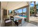 Outdoor patio area with seating, string lights, and a refreshing view of the pool at 2702 S Beverly Pl, Chandler, AZ 85286