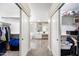 Walk-in closet leading to a luxurious bathroom with modern fixtures and plenty of storage at 2702 S Beverly Pl, Chandler, AZ 85286