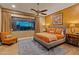 Comfortable bedroom featuring a large window with desert view, a ceiling fan, and tasteful decor at 30556 N Sage Dr, Peoria, AZ 85383
