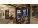 Elegant dining room features a designer chandelier and large windows with stunning desert views at 30556 N Sage Dr, Peoria, AZ 85383