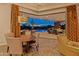 Stylish dining room offers seamless indoor-outdoor living with views of the pool and desert landscape at 30556 N Sage Dr, Peoria, AZ 85383