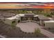 Expansive luxury home featuring a circular driveway, desert landscaping and beautiful sunset views at 30556 N Sage Dr, Peoria, AZ 85383